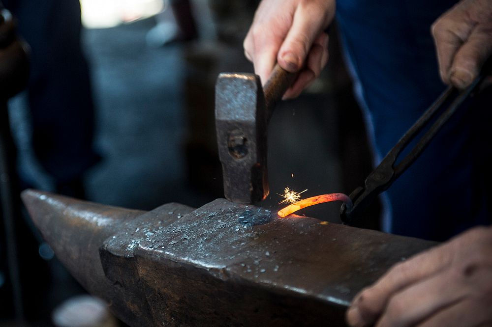 MYSTIC, Conn. -- Civil engineering and naval architecture majors from the U.S. Coast Guard Academy learn basic blacksmithing…