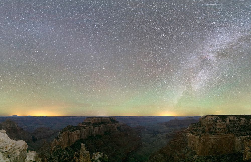 The Milky Way illumines an opalescent night sky over dramatic rock formations near Cape Royal Trail at the North Rim of…