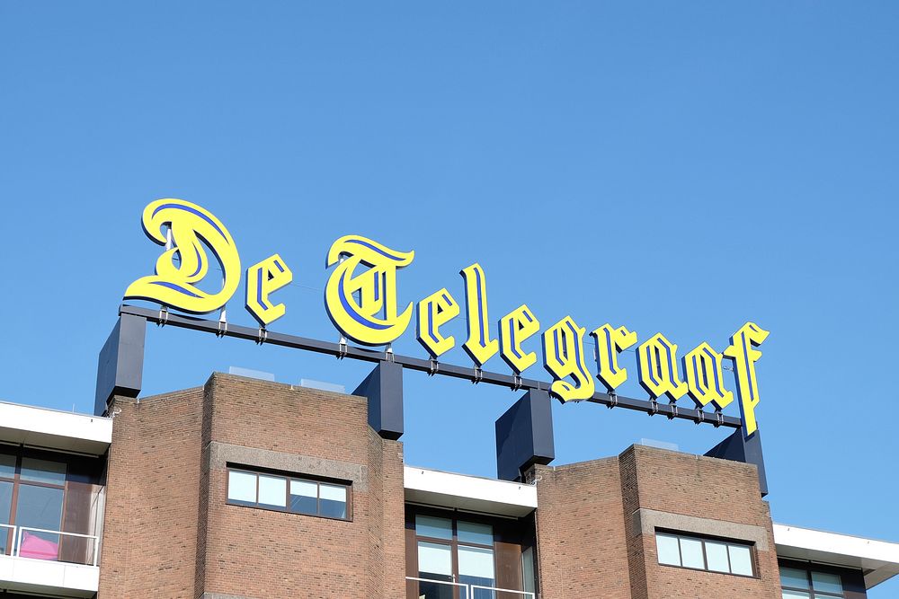 De Telegraaf, sign on the head office of Dutch newspaper. Amsterdam, Netherlands - May 7, 2016