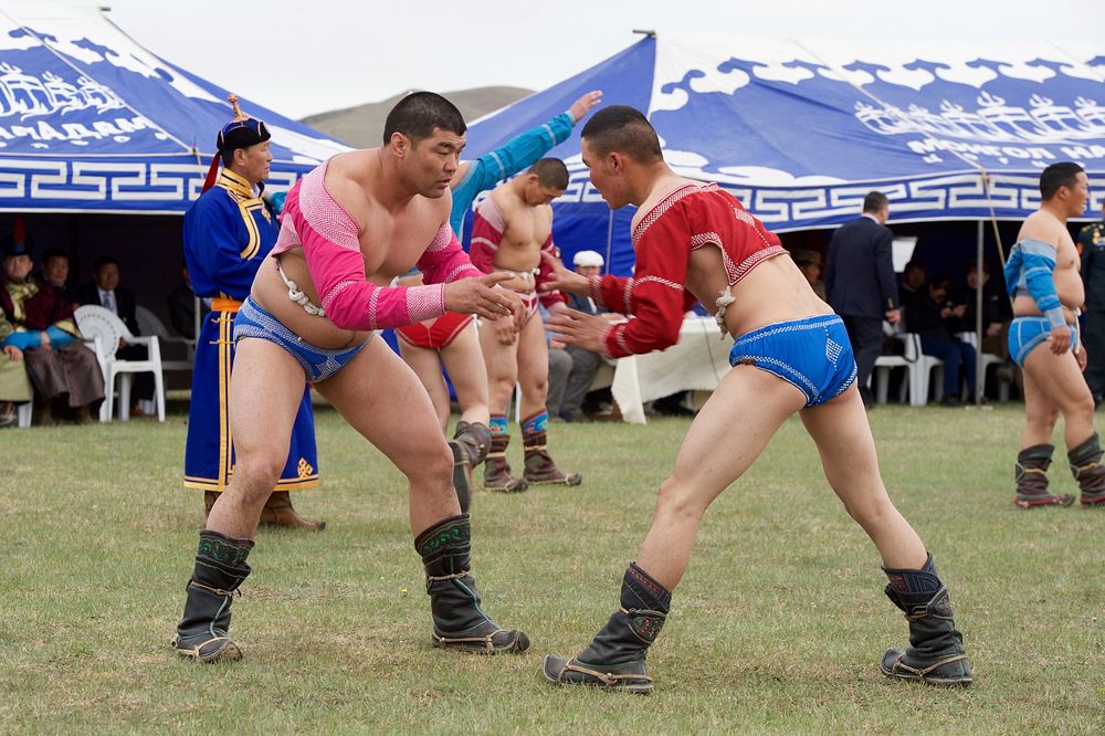 Men Traditional Wrestling Outfits Stage a Display as Secretary Kerry Attends a "Mini-Nadaam" in a Field Outside Ulaanbaatar