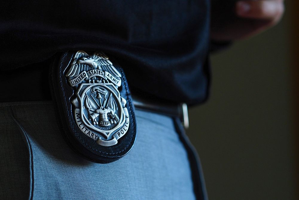 A Military Police badge is seen displayed on the belt of a soldier, assigned to the 545th Military Police Detachment, 17th…