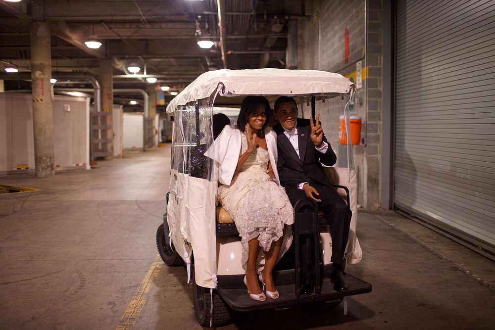 President Barack Obama and First Lady Michelle Obama ride in a golf cart at an Inaugural Ball in Washington, D.C, Jan. 20…