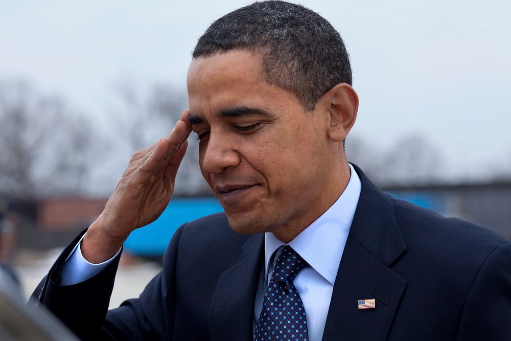 President Barack Obama salutes at Andrews Air Force Base before departing for Columbus, Ohio, March 6, 2009.