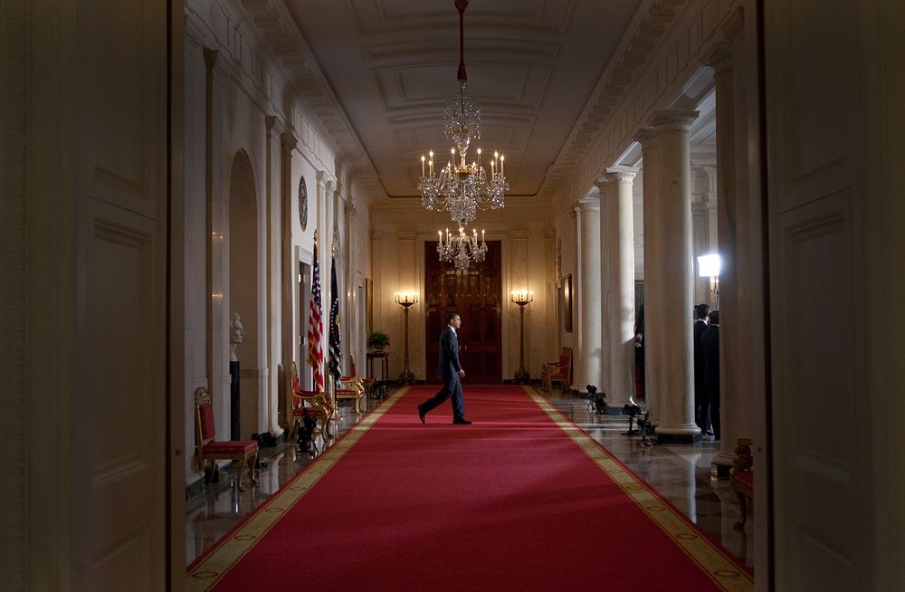 President Barack Obama walks to a podium in the Cross Hall, Grand Foyer of the White House, before making a statement…