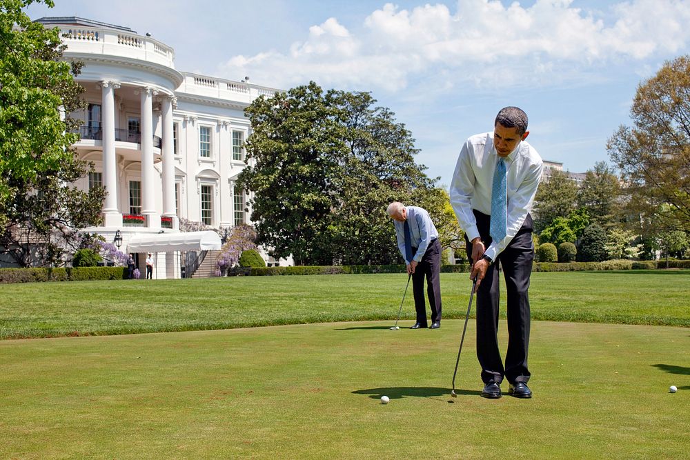 President Barack Obama and Vice President Joe Biden practice their putting on the White House putting green April 24, 2009.