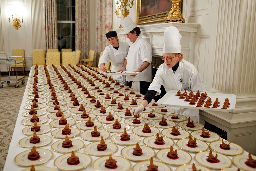 Dessert plates are prepared by Assistant Pastry Chef Susie Morrison in the State Dining Room of the White House, March 4…