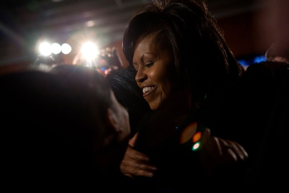 First Lady Michelle Obama hugs a supporter during her visit to the Department of Homeland Security in Washington, D.C.…
