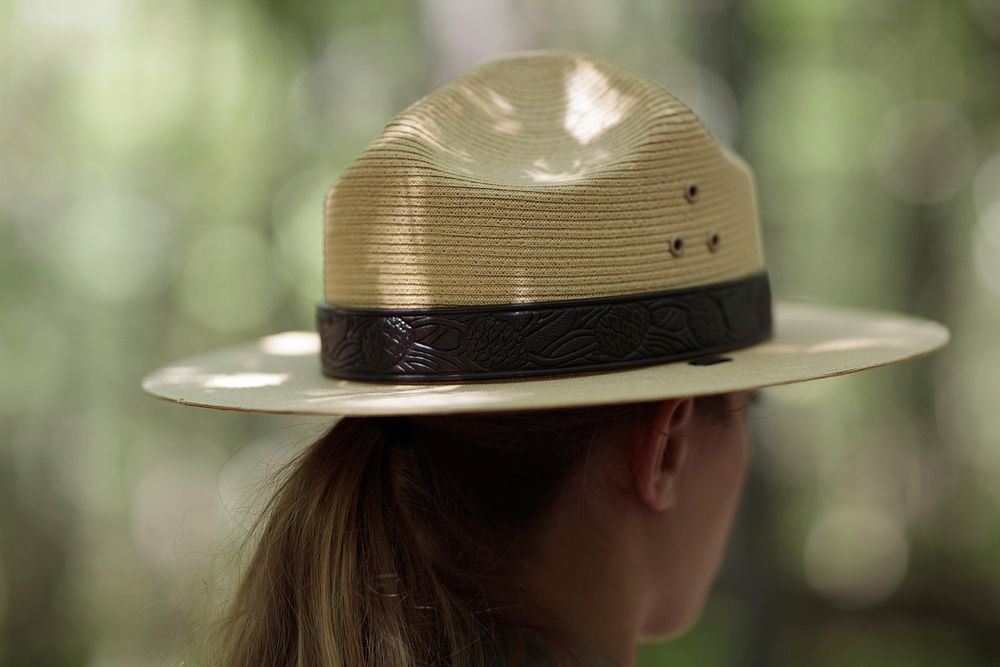 Woman wearing sun hat. Free public domain CC0 image.