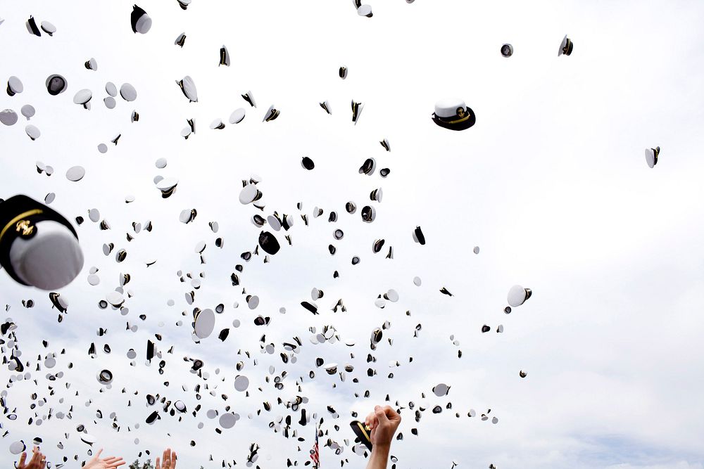 Graduates toss their hats into the air at the end of the United States Naval Academy graduation ceremony May 22, 2009.