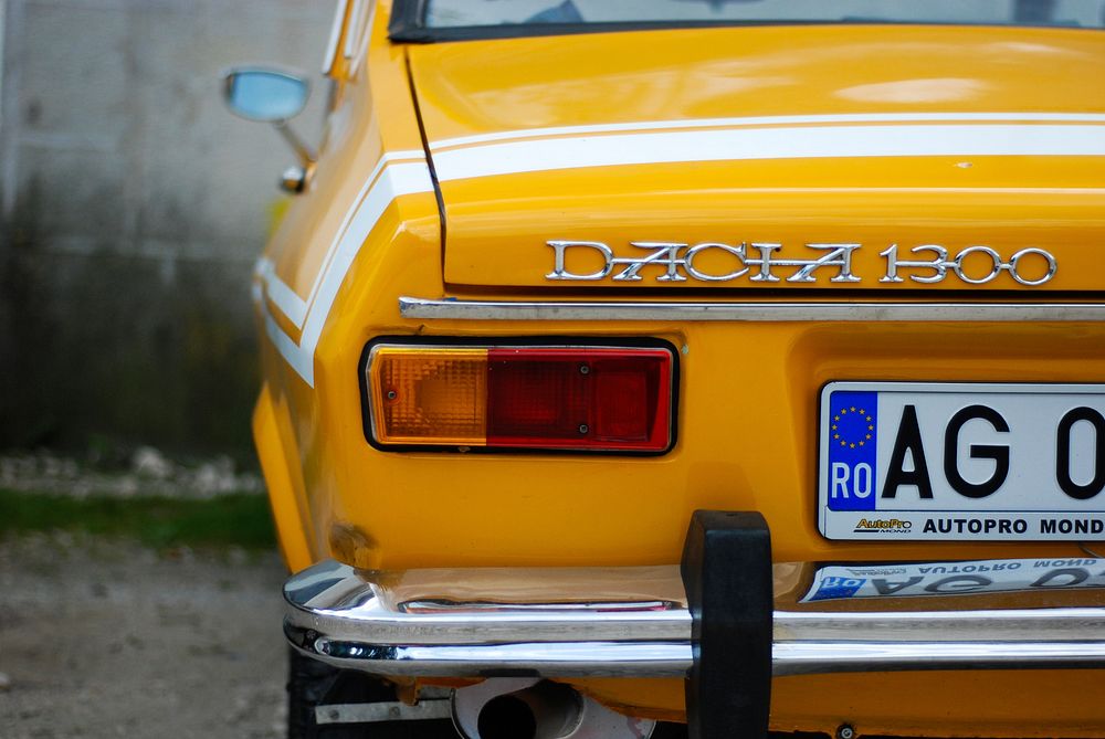 Yellow Dacia 1300 car, location unknown, date unknown.