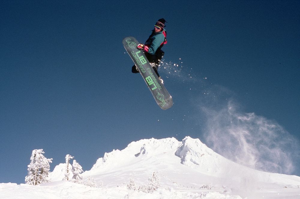 Man enjoying snowboarding at the top of mountain Mt Hood NF. Original public domain image from Flickr