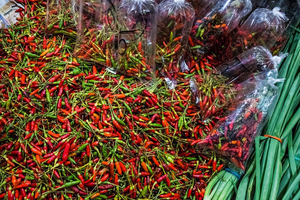 Red chilies at a local market. Free public domain CC0 photo.