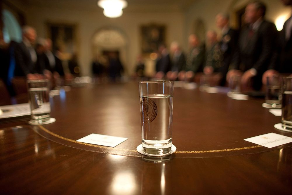 A glass of water with the presidential seal rests on the table in the Cabinet Room of the White House, prior to President…