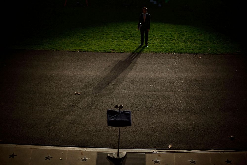 Deputy Director of Oval Office Operations Brian Mosteller's shadow is cast during a ighting test on the South Lawn of the…