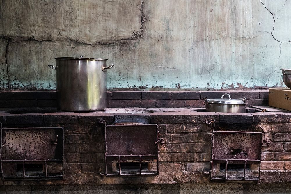 Food preparation in an old kitchen. Free public domain CC0 photo.