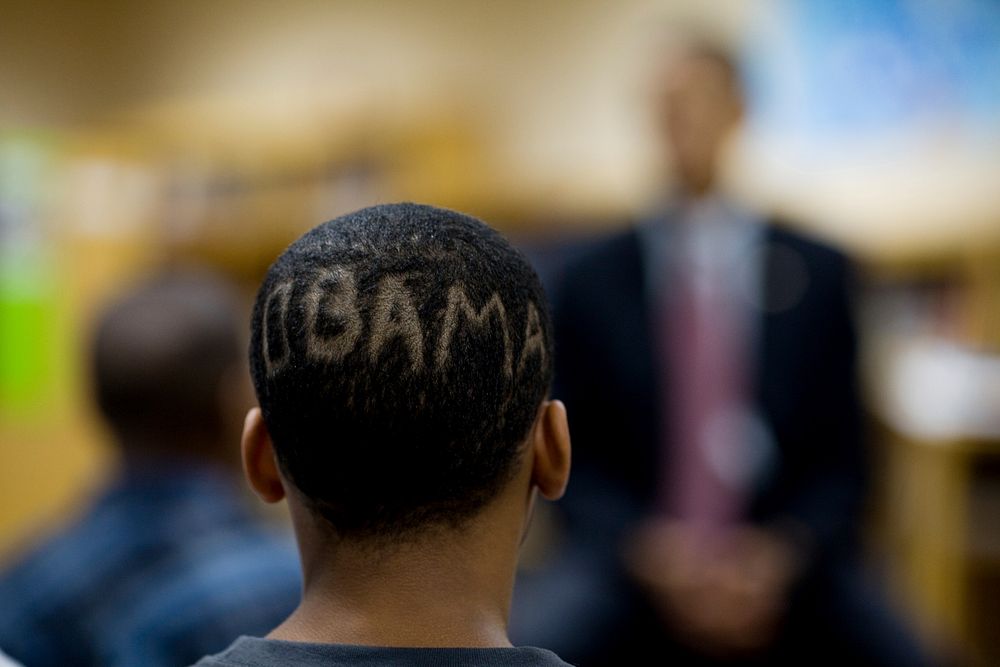 A student with &ldquo;Obama&rdquo; shaved into his hair listens to President Barack Obama speak at Wright Middle School in…