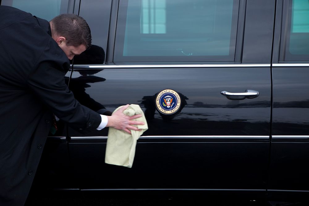 The Presidential limousine gets a quick cleaning before a trip taking President Barack Obama to a conference at the Newseum…