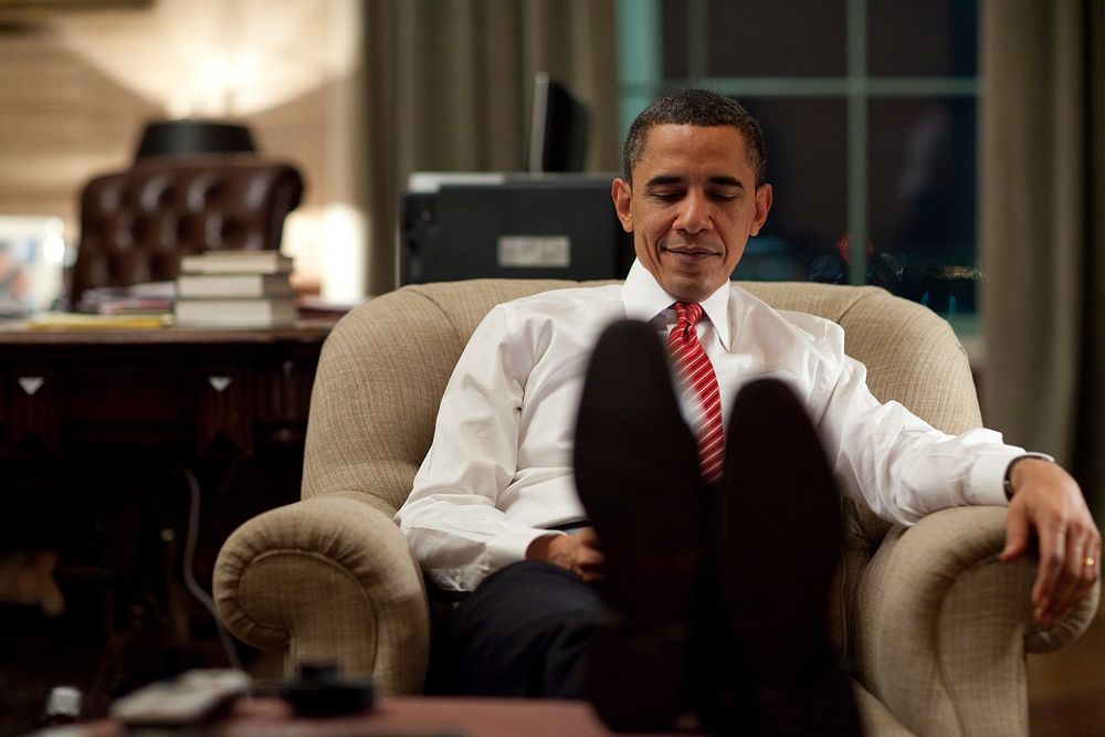 President Barack Obama reacts to a BlackBerry message in the Treaty Room office in the private residence of the White House…