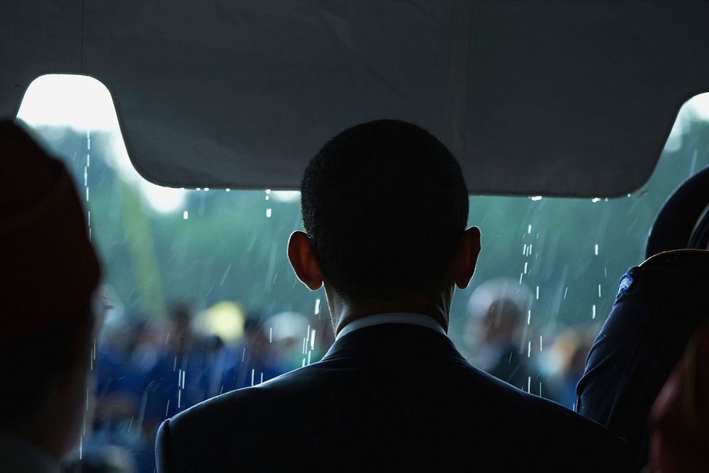 As rain falls, President Barack Obama begins to take part in the annual Memorial Day ceremony at Abraham Lincoln National…