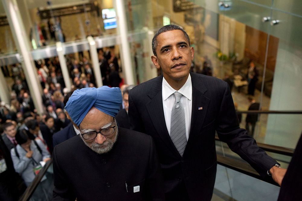 President Barack Obama and Indian Prime Minister Manmohan Singh ride an escalator on the way to their bilateral meeting…