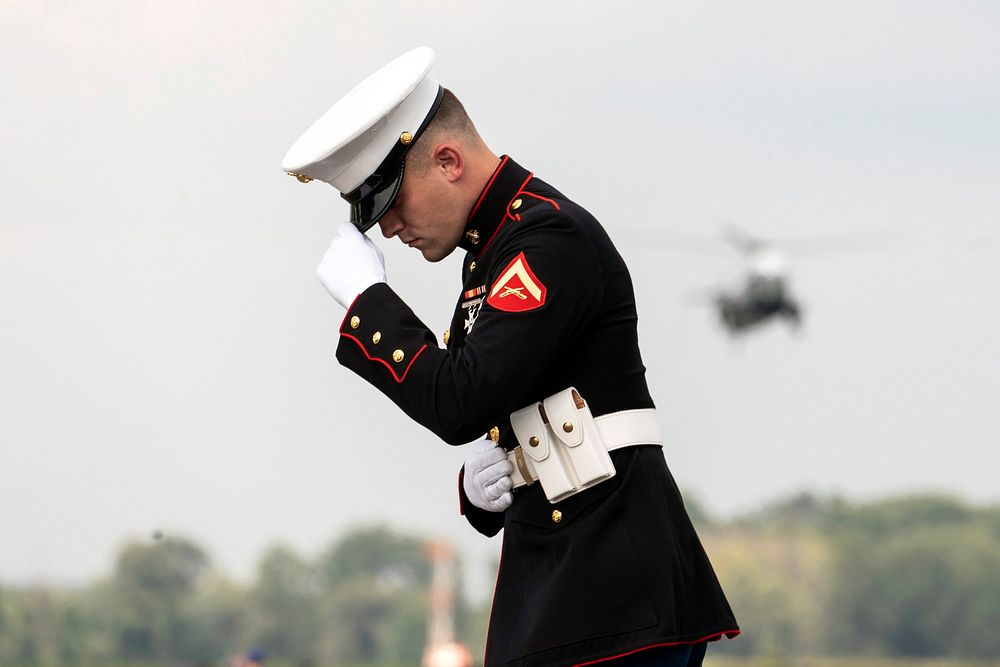 President Trump Returns to D.C.A U.S. Marine holds on to his hat as Marine One approaches for landing Sunday, Aug. 18, 2019…
