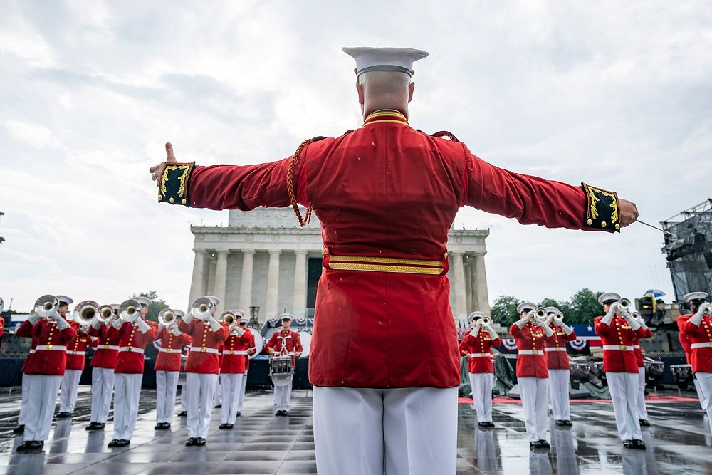 Salute to America Members of the U.S. Marine Corps Band march in formation and perform at the Salute to America event…