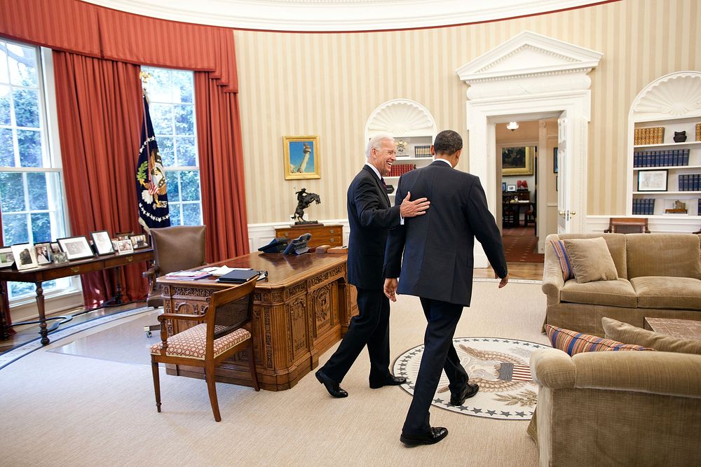 President Barack Obama and Vice President Joe Biden head toward the Oval Office Private Dining Room for lunch, June 8, 2011.