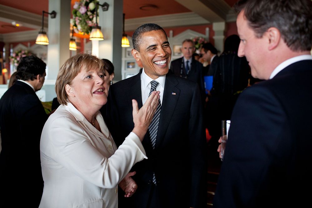 President Barack Obama talks with German Chancellor Angela Merkel and British Prime Minister David Cameron before the start…