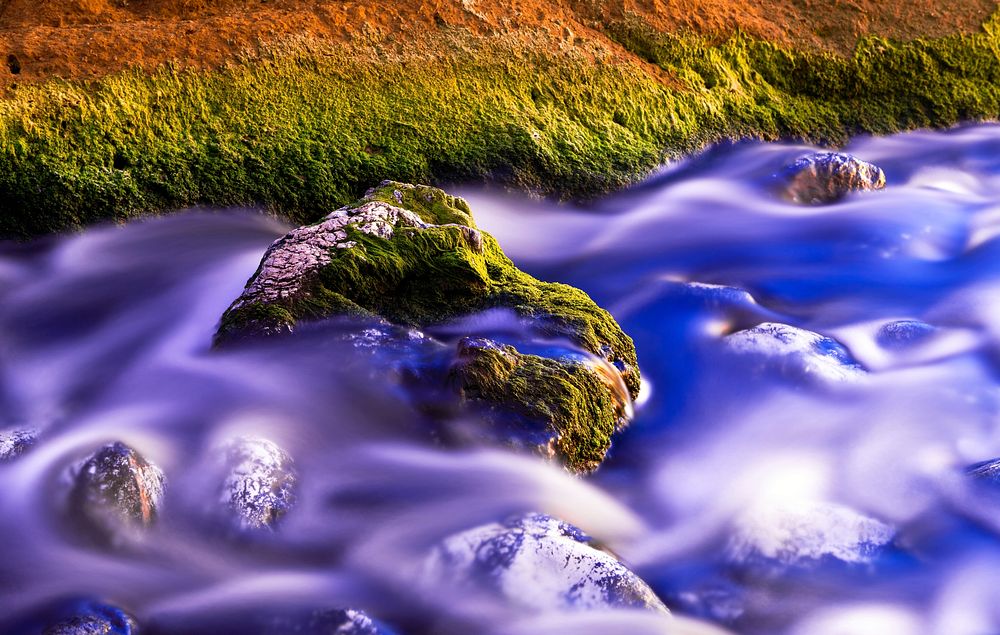 Water flowing down rocks. Free public domain CC0 photo.