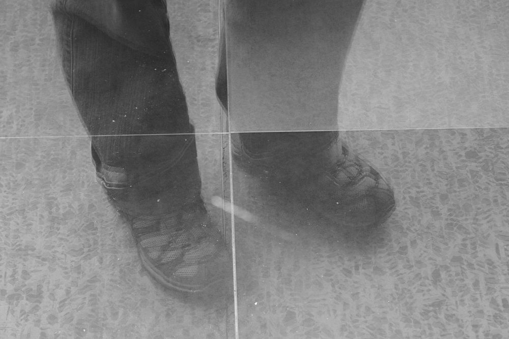 Mirrored images of man wearing hiking shoes. Free public domain CC0 image