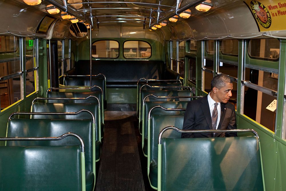 President Barack Obama sits on the famed Rosa Parks bus at the Henry Ford Museum following an event in Dearborn, Mich.…