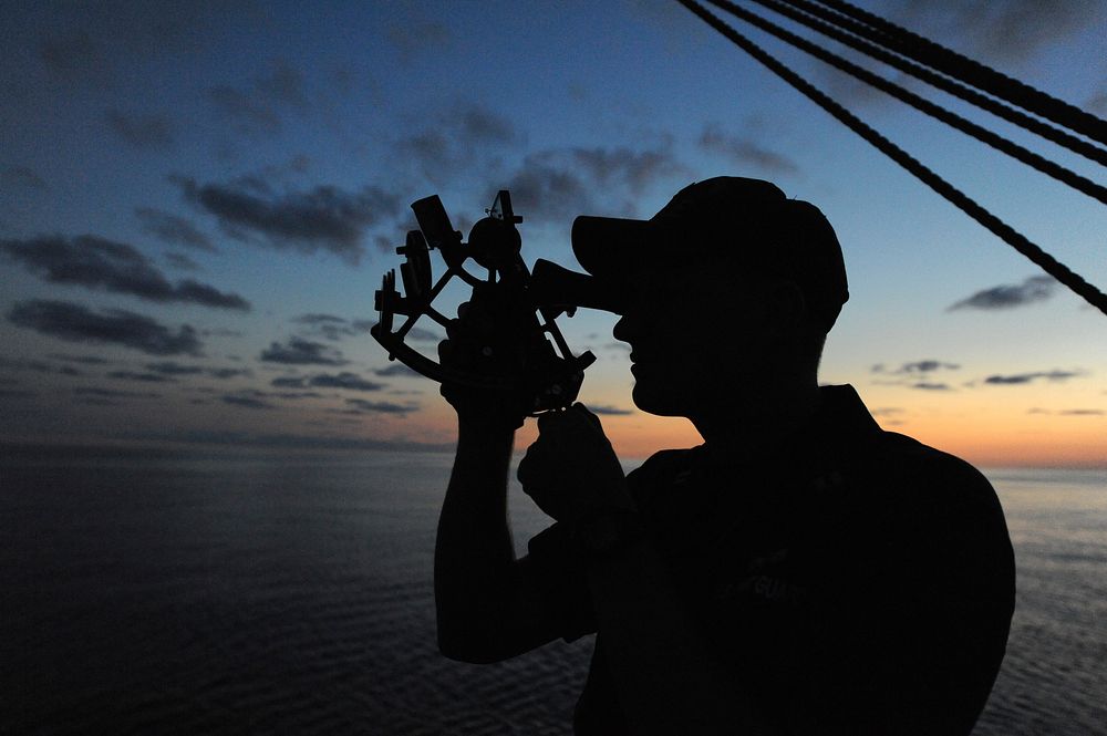 Officer Candidates Aboard Barque Eagle : ATLANTIC OCEAN - A U.S. Coast Guard Academy officer candidate practices navigating…