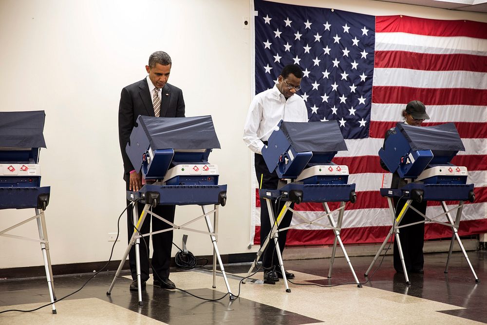 President Barack Obama casts his ballot during early voting at the Martin Luther King Jr. Community Center in Chicago, Ill.…