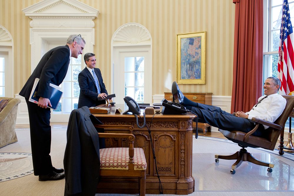 President Barack Obama talks with Chief of Staff Denis McDonough and Miguel Rodriguez, Director of Legislative Affairs, in…