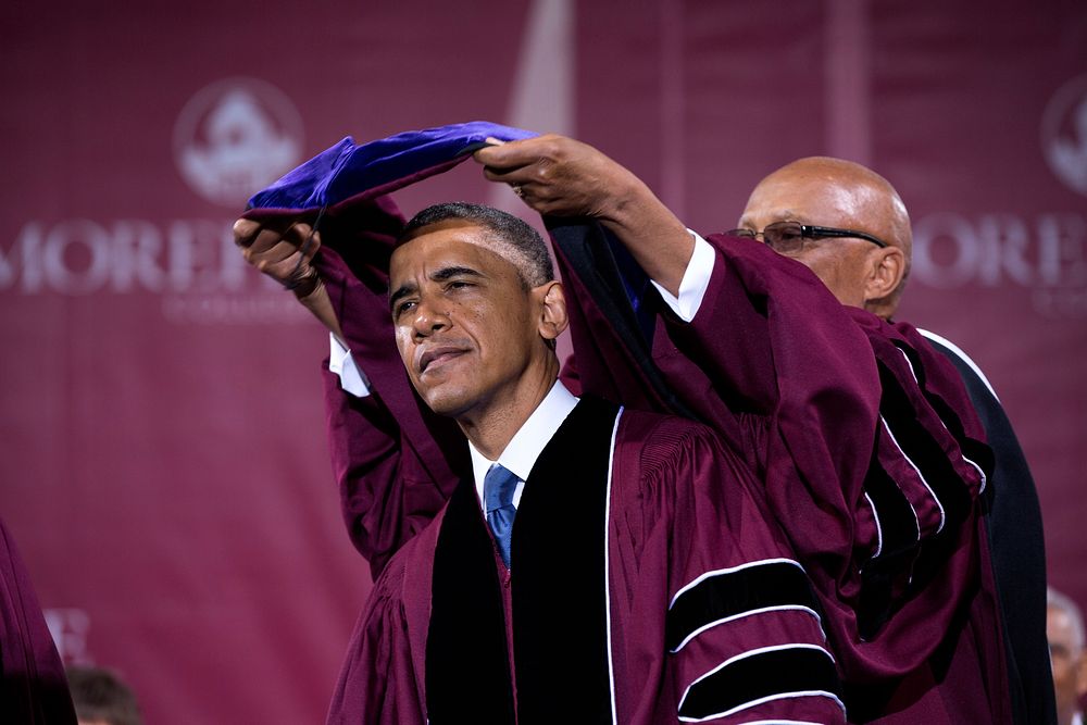 Dr. John Wilson Jr., President of Morehouse College, presents President Barack Obama with an honorary Doctor of Laws degree…