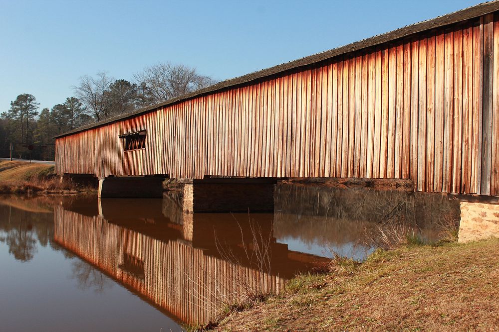 Old wooden bridge on lake. Free public domain CC0 photo.