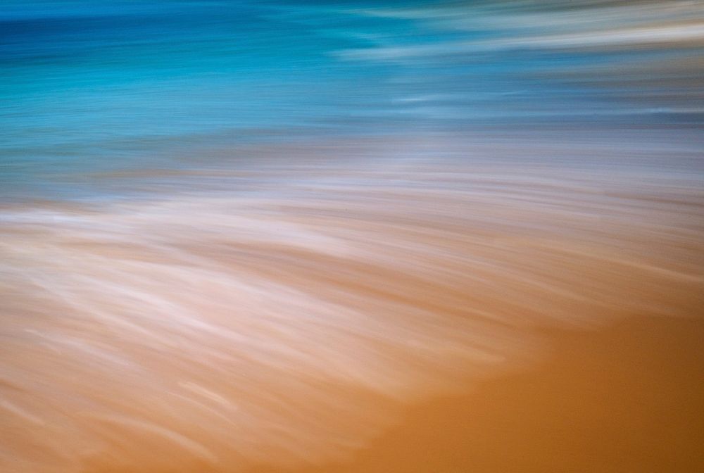Waves crashing into the sand. Free public domain CC0 photo.