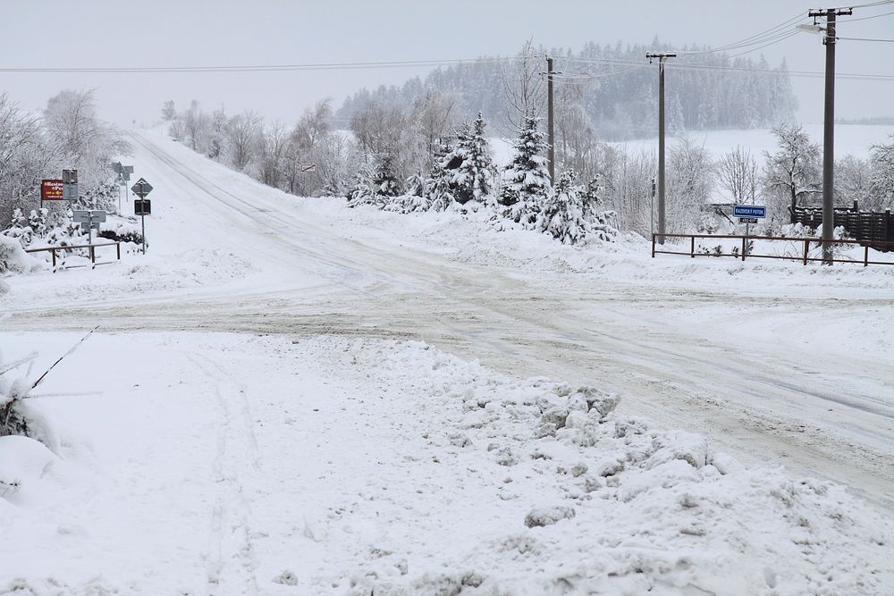 Empty road covered in snow. Free public domain CC0 image.