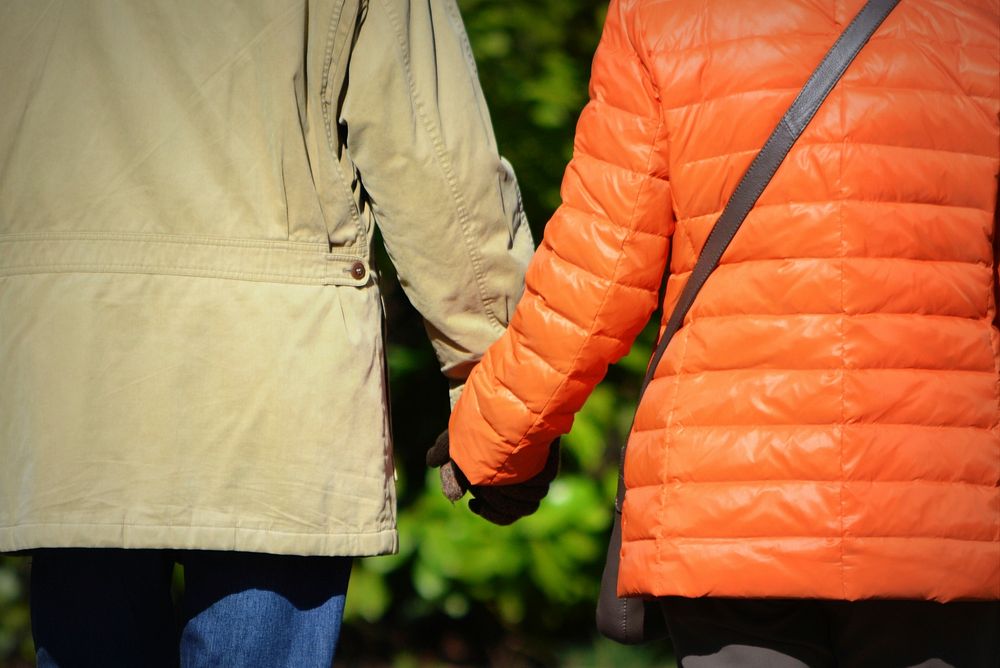 Couple wlaking together outdoors. Free public domain CC0 photo.