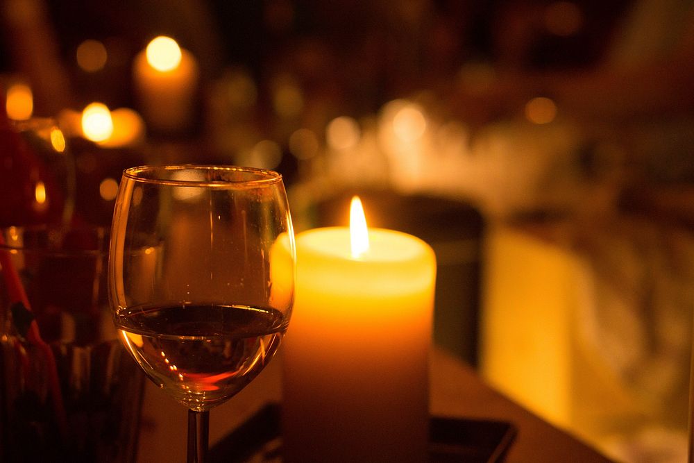 Glass of wine and candle. Free public domain CC0 photo.