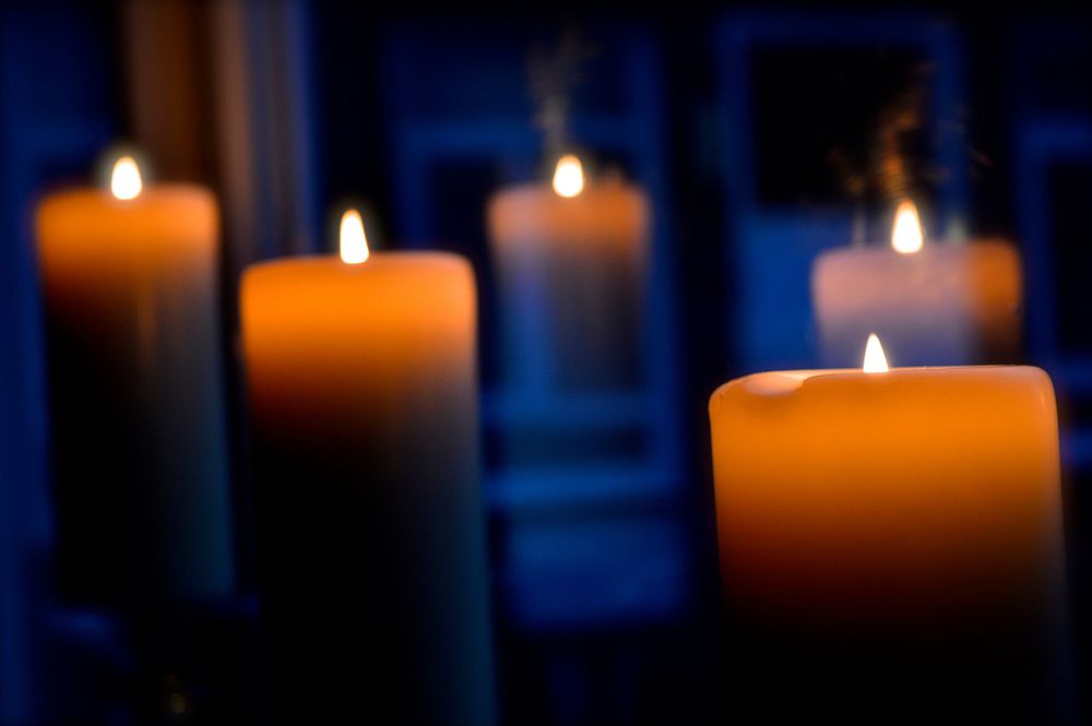 Burning candles in the dark. Free public domain CC0 image.