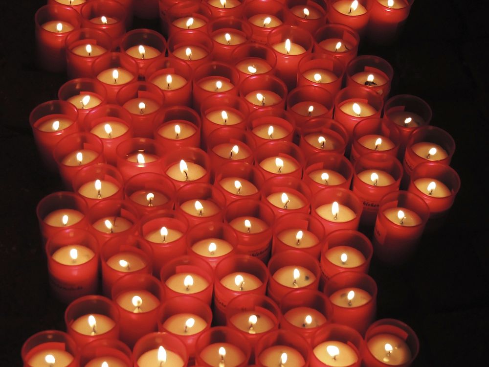 Burning candles in the dark. Free public domain CC0 image.