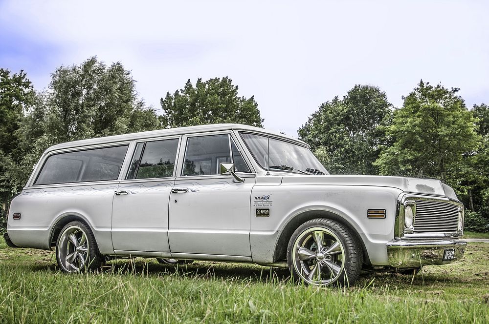 Car parked on the lawn. Free public domain CC0 photo.