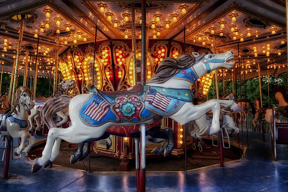Carousel at amusement park. Free public domain CC0 photo.