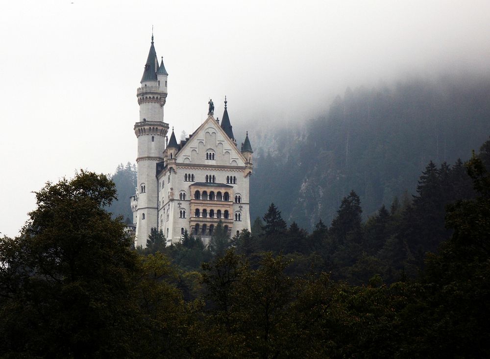 The Neuschwanstein Castle in Germany on a foggy day. Free public domain CC0 photo.