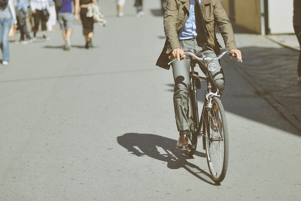 Person biking on a bicycle. Free public domain CC0 photo.
