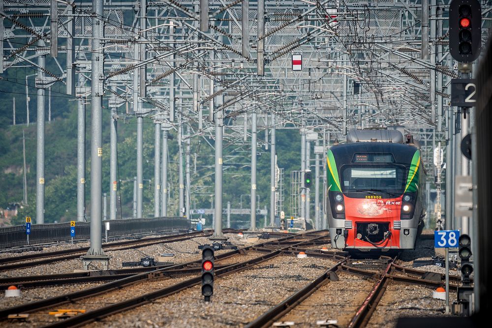 Moving train on a track. Free public domain CC0 photo.