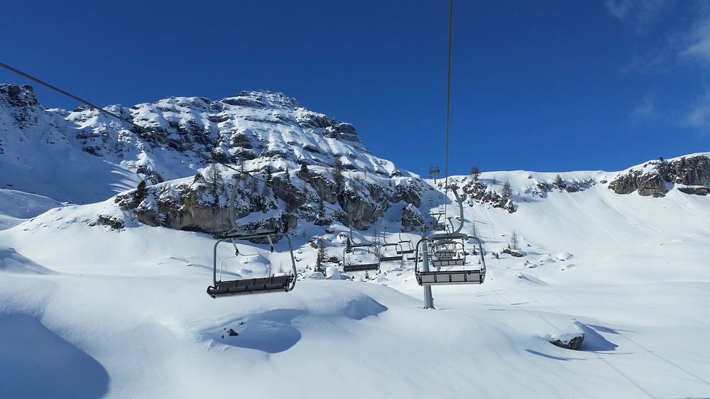 Ski chair lifts in snowy mountains. Free public domain CC0 image. 