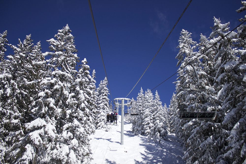 Ski lift up snowy mountain. Free public domain CC0 photo.
