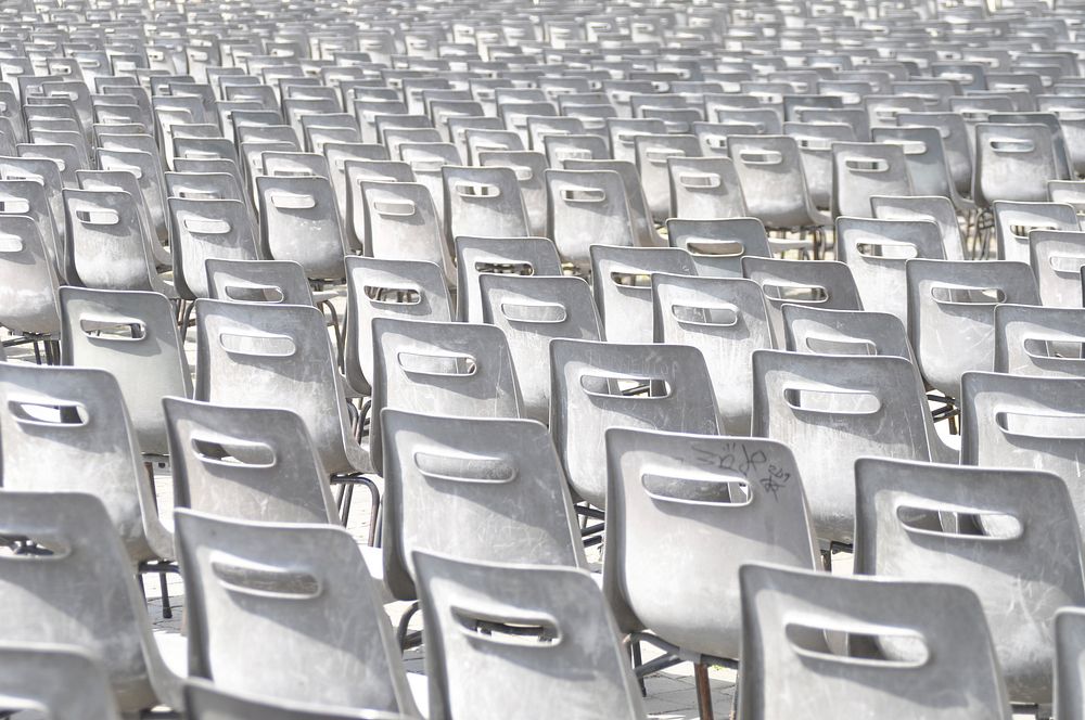 Empty rows of white chairs. Free public domain CC0 photo.